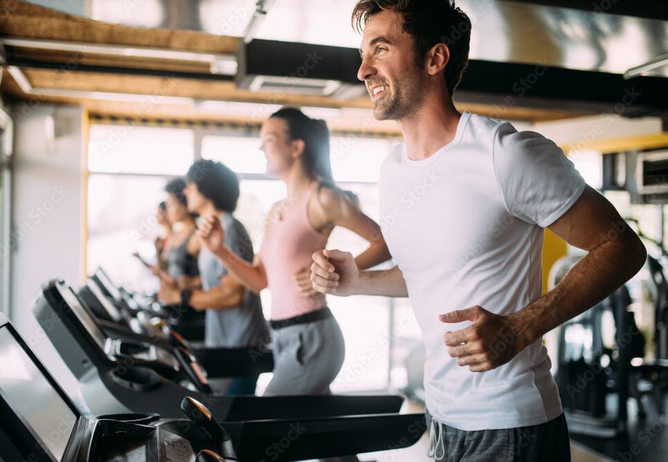 Group of sportive people in a gym. Concepts about lifestyle and sport in a fitness club